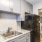 a kitchen with light cabinets