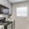 a kitchen with white cabinets