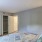 a bedroom with a bed and a closet