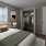 Bedroom with natural lighting and high ceilings