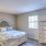 a bedroom with a bed and dresser
